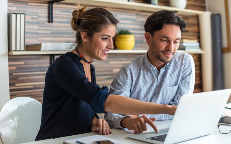 A single solution for application resilience Two business professionals working on laptop computer