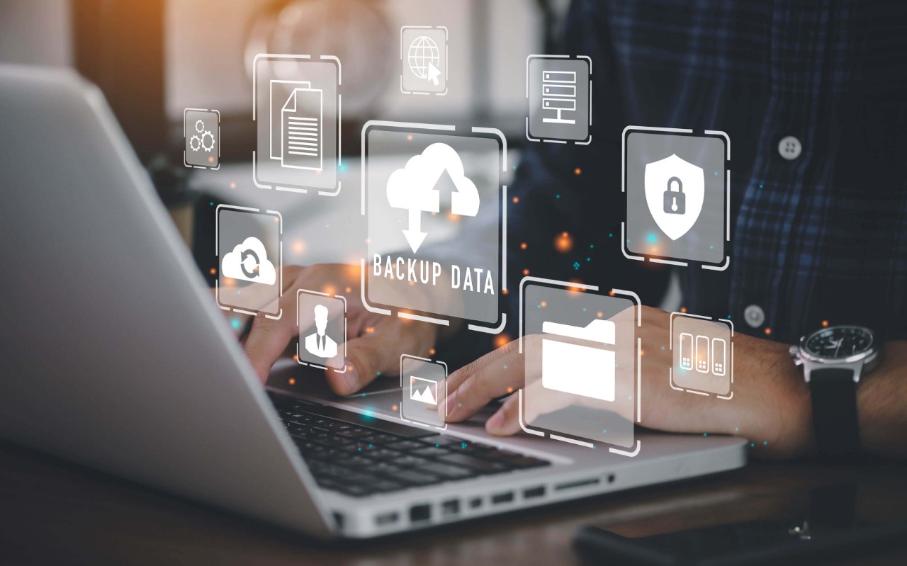 Optimize your cloud Person using a laptop with security icons