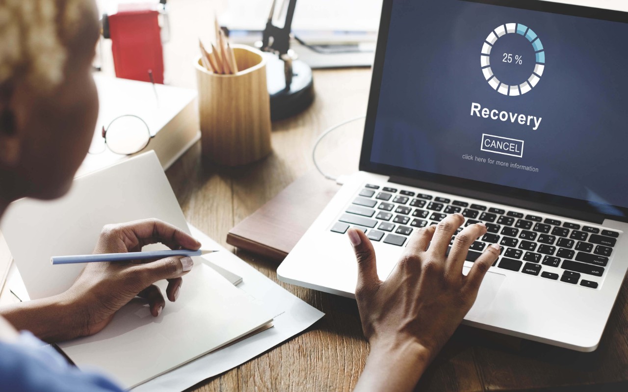 Best-in-class backup and recovery Woman usign her laptop at the office