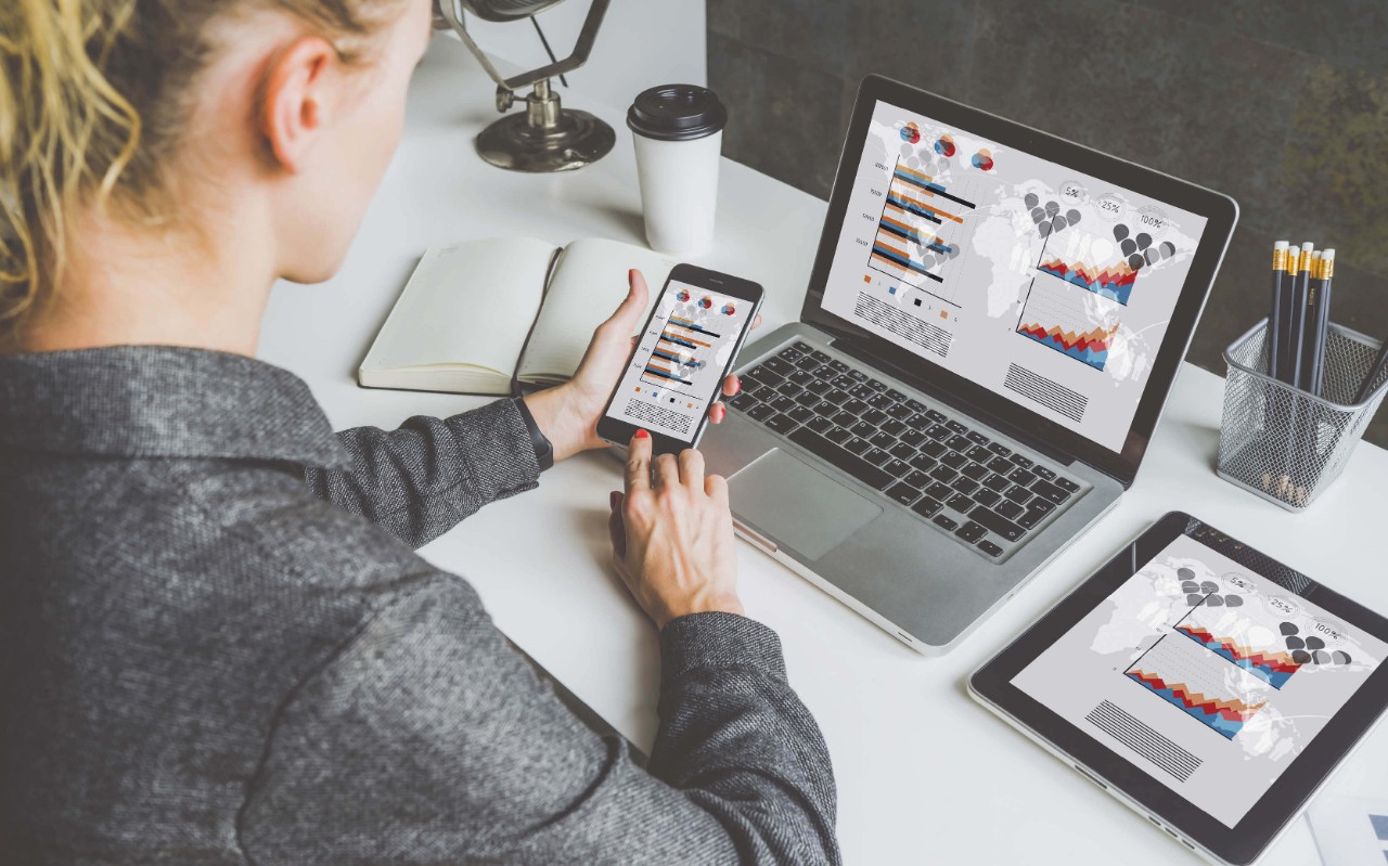 Immutable and indelible storage Woman using her devices at work