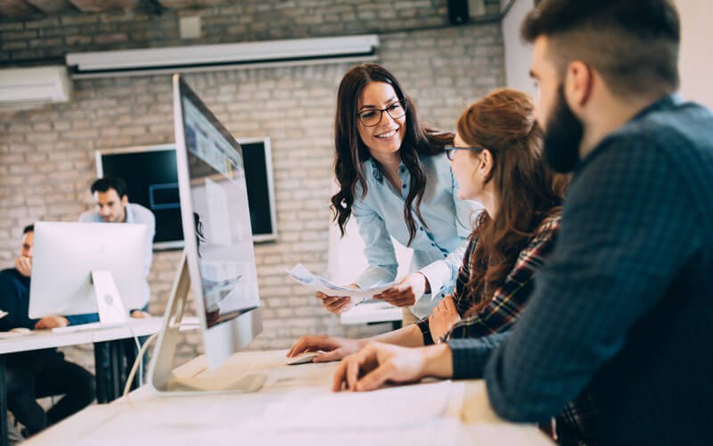 Zero trust foundations Three users smiling over desktop