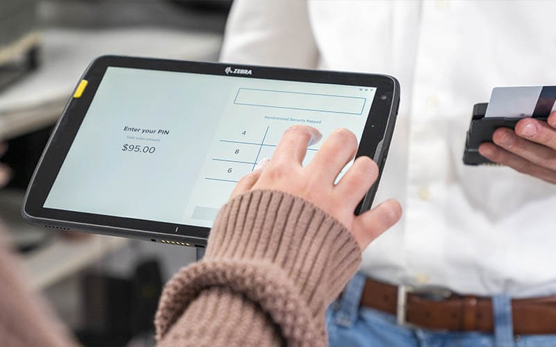 Meet the ET40/45 Enterprise Tablet. Person using the ET40/45 Enterprise Tablet.