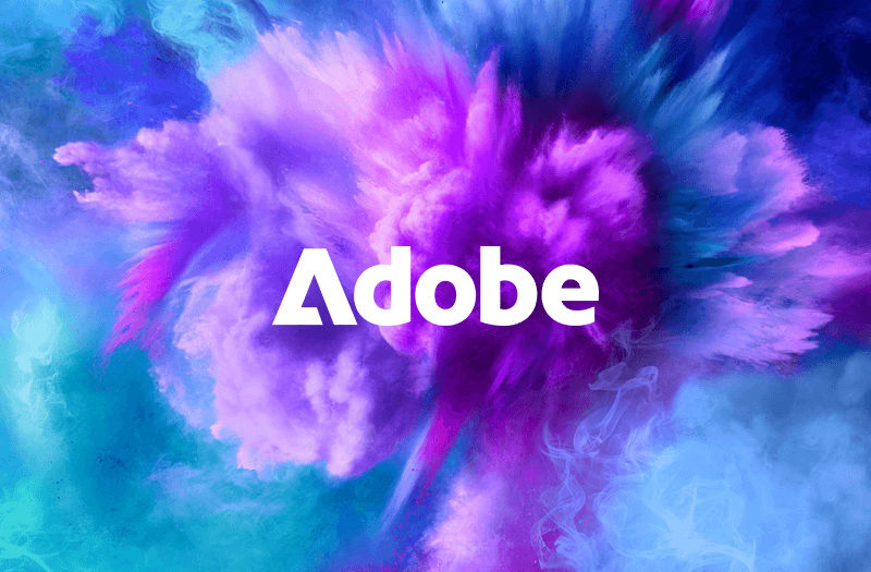 Software challenges end here Adobe logo displayed around a cloud of multicolored explosion of powder
