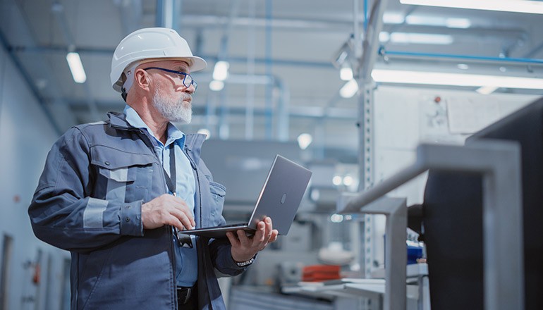 man-working-in-manufacturing-factory-with-tech-article-thumb man-working-in-manufacturing-factory-with-tech-article-thumb