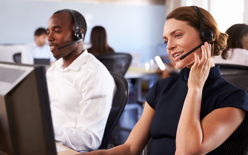 Insight is always by your side with U.S.-based technical support Two call center representatives on headsets