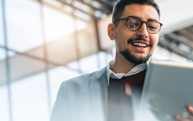 Our security assessment equips you with the information you need to implement enterprise-wide protection Businesswoman in glasses reviews security assessment on computer